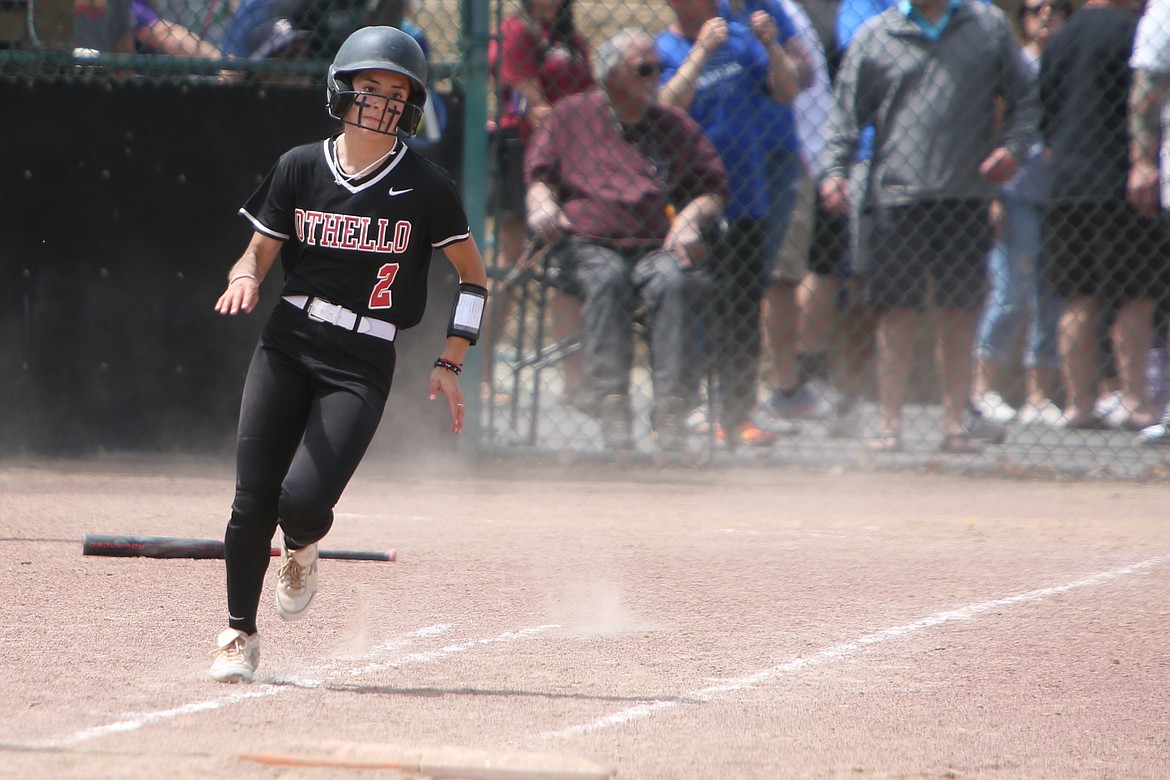 Othello senior Naraiah Guzman dashes toward first base after recording an RBI single during the top of the seventh inning against Olympic on Friday.