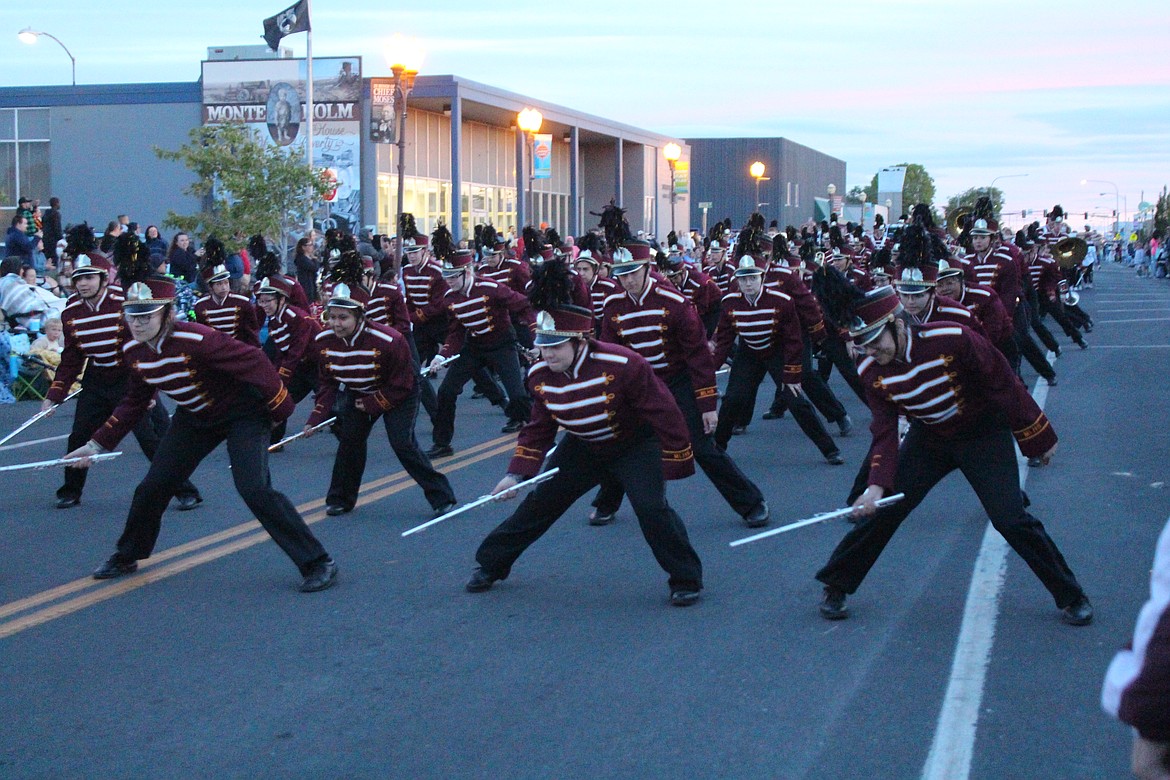 The Moses Lake High School marching band busts a move during the Spring Festival parade. Organizers said the event attracted one of the biggest crowds in recent memory.