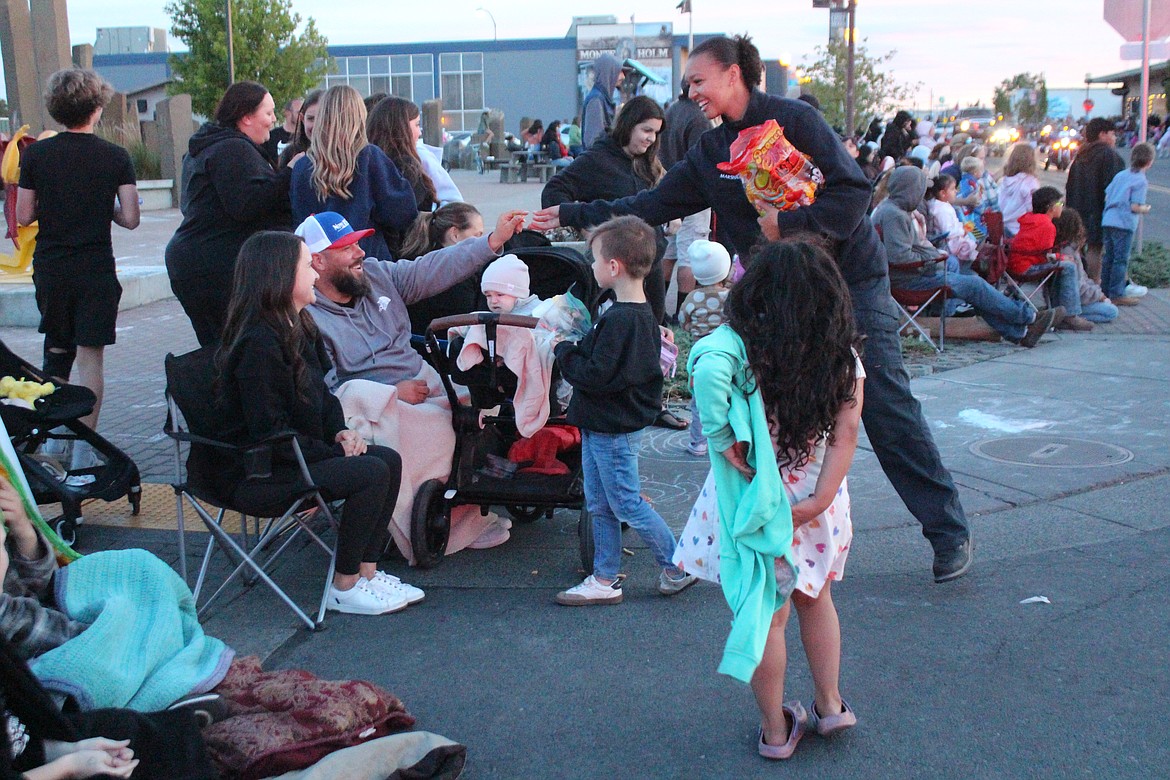 A Moses Lake firefighter hands out candy on the Spring Festival parade route.