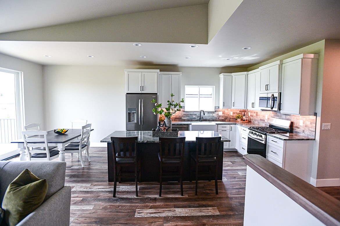 The kitchen and dining area are shown during an open house for the latest finished home in the Kalispell Student Built Homes program at 225 Northridge Way on Wednesday, May 15. (Casey Kreider/Daily Inter Lake)