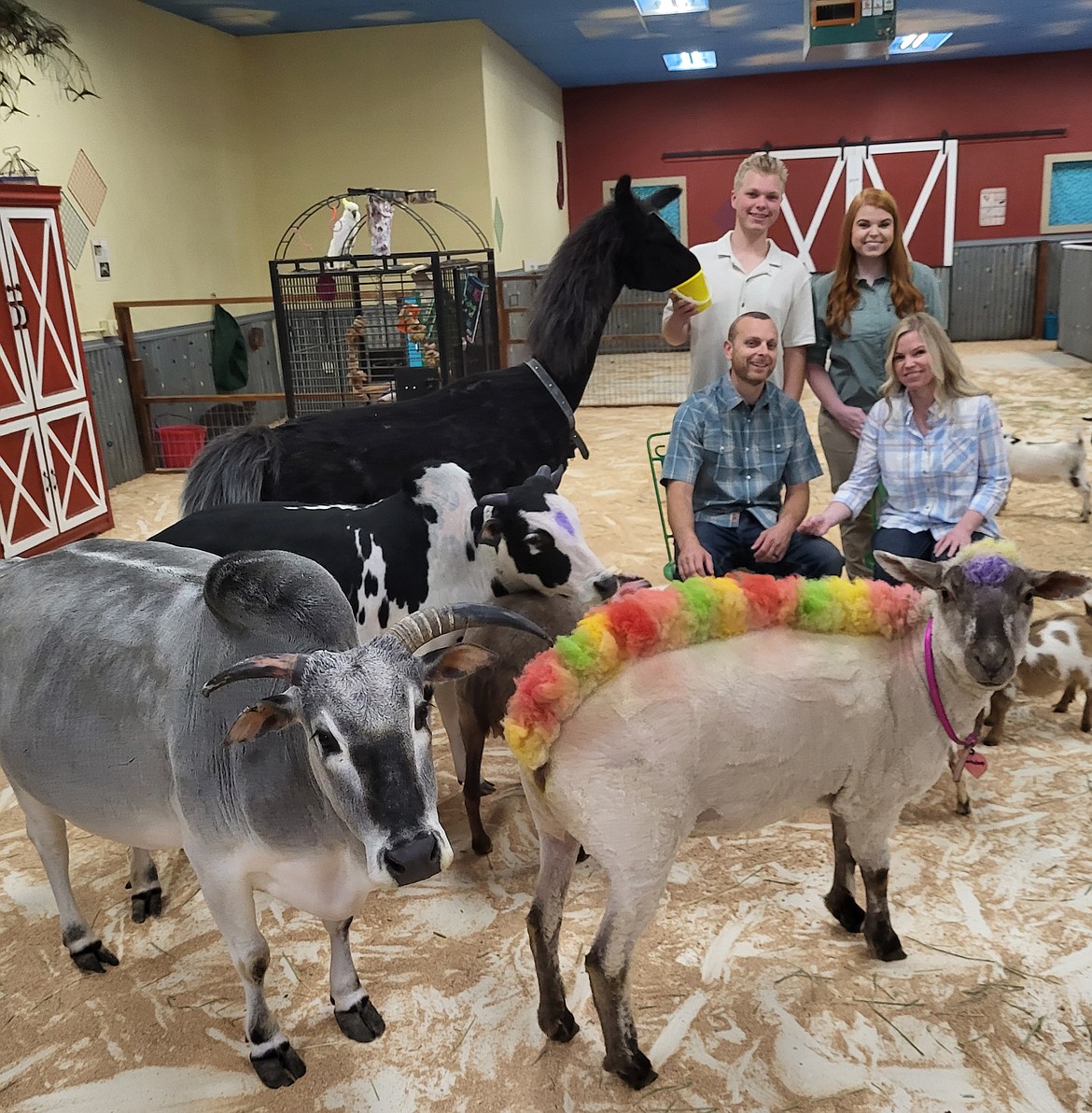 Big Red's Barn new owners (front row) Jason and Ginger Harris; and (back row) kids Jace and Haely Harris.