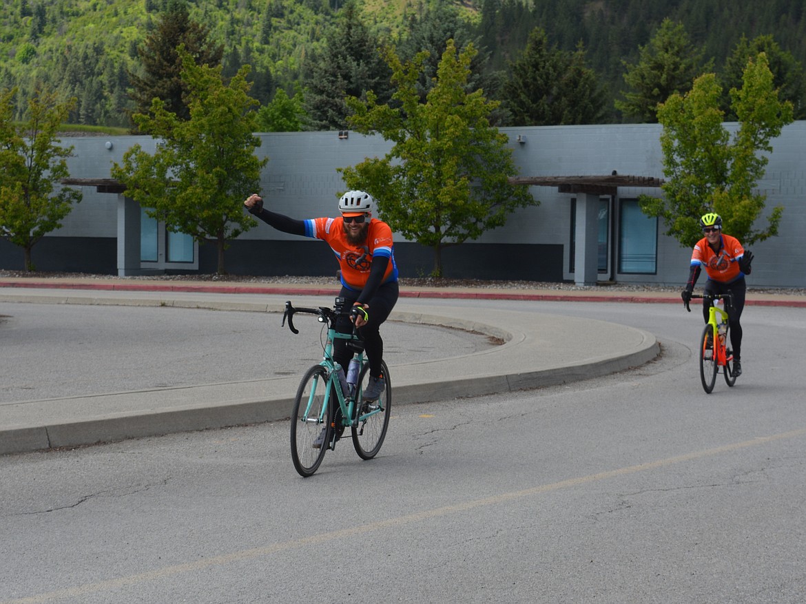 Paul Richards, of Ohio and Rossie Bullock, of North Carolina, celebrate reaching their destination in Kellogg. The riders are part of the Fuller Center Bicycle Adventure raising money for housing needs.