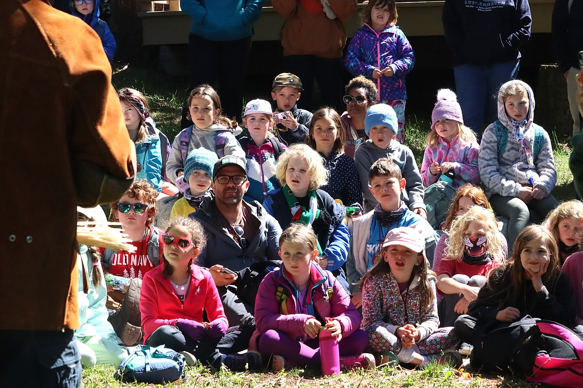 Kids at Camp Lutherhaven watch as Birds of Prey Northwest prepares to release a rehabbed bald eagle on Thursday.