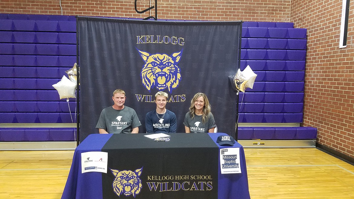 Courtesy photo
Kellogg High senior Jaeger Hall recently signed a letter of intent to wrestle at NAIA Missouri Baptist University in Creve Coeur, Mo. From left are Chad Hall (father), Jaeger Hall and Loni Hall (mother).