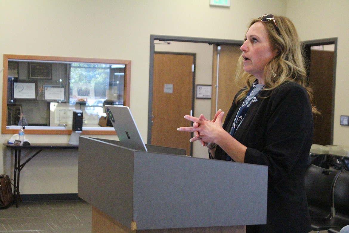 Trisha Schock of the North Central ESD reviews the details of an interfund loan for the Moses Lake School Board Thursday.