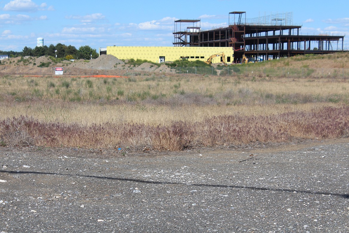 A piece of Moses Lake School District property next to the new Samaritan Hospital, background, could be the site of Grant County’s new morgue. The facility has been located inside the current Samaritan building in Moses Lake, but the new hospital won’t include a morgue space.