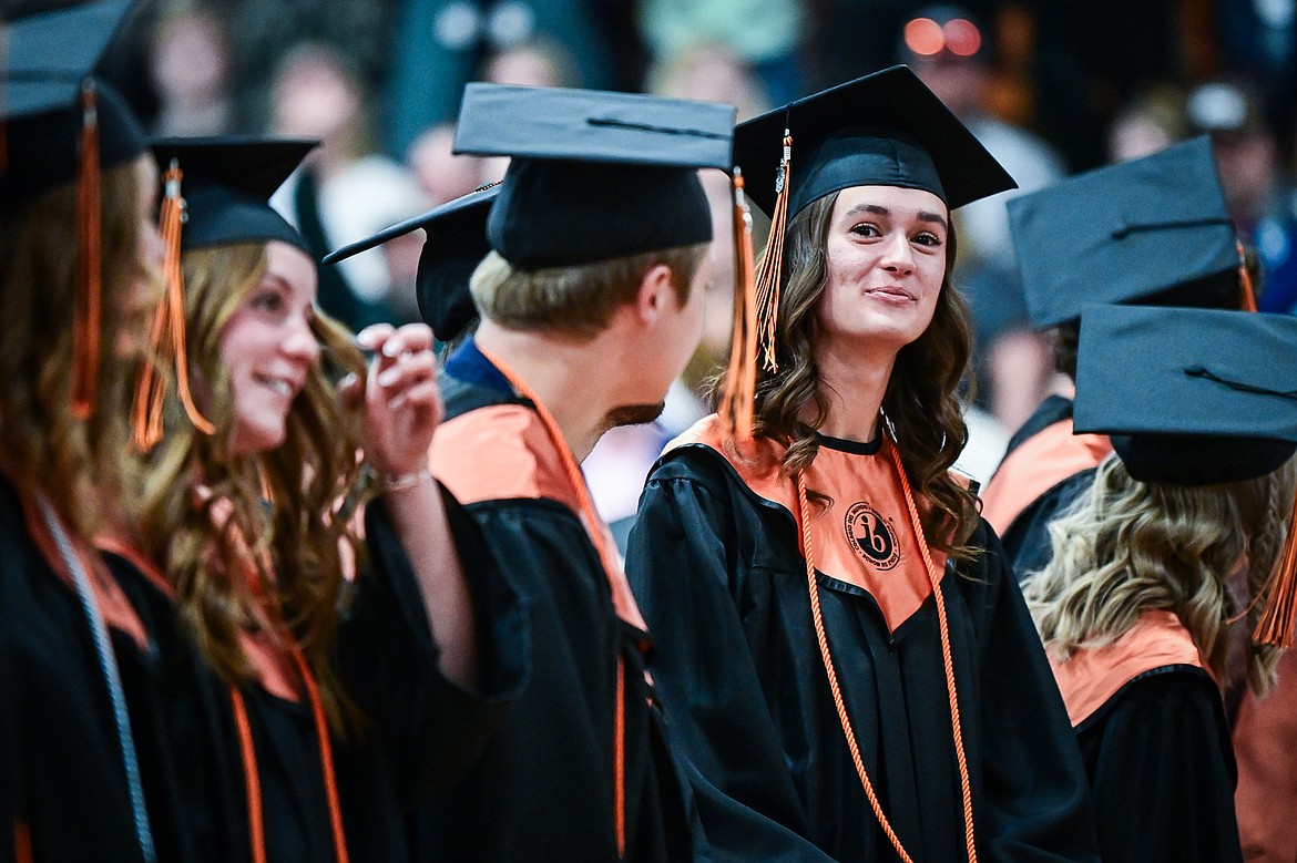 Graduates smile as they take their seats during Flathead High School's class of 2024 graduation ceremony on Friday, May 31. (Casey Kreider/Daily Inter Lake)