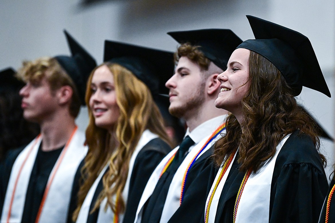 Graduates smile as they take their seats during Flathead High School's class of 2024 graduation ceremony on Friday, May 31. (Casey Kreider/Daily Inter Lake)