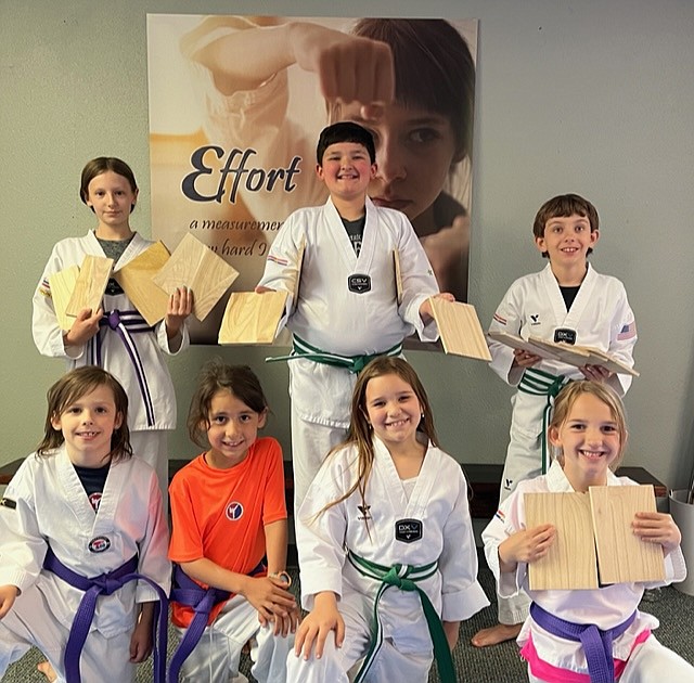 The Sandpoint Martial Arts Intermediate Group. Front row, from left are Elijah Mor (Purple Belt), Reece Elvira (Purple Belt), Elaina Tope (Green Belt White Stripe) and Lillian Batchelor (Purple Belt). Back row, from left are Liley Hedlund (Purple Belt White Stripe), Ethan Garza (Green White Stripe) and Bryson Sahleen (Green White Stripe)