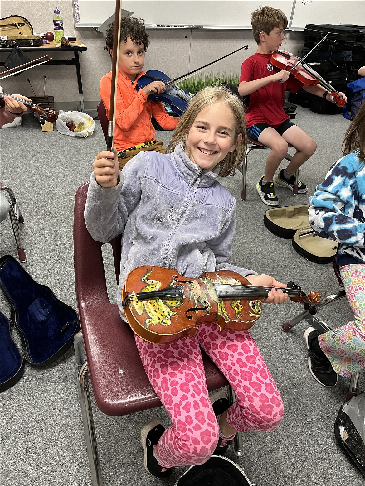 A Washington Elementary student takes part in Fiddle Camp.