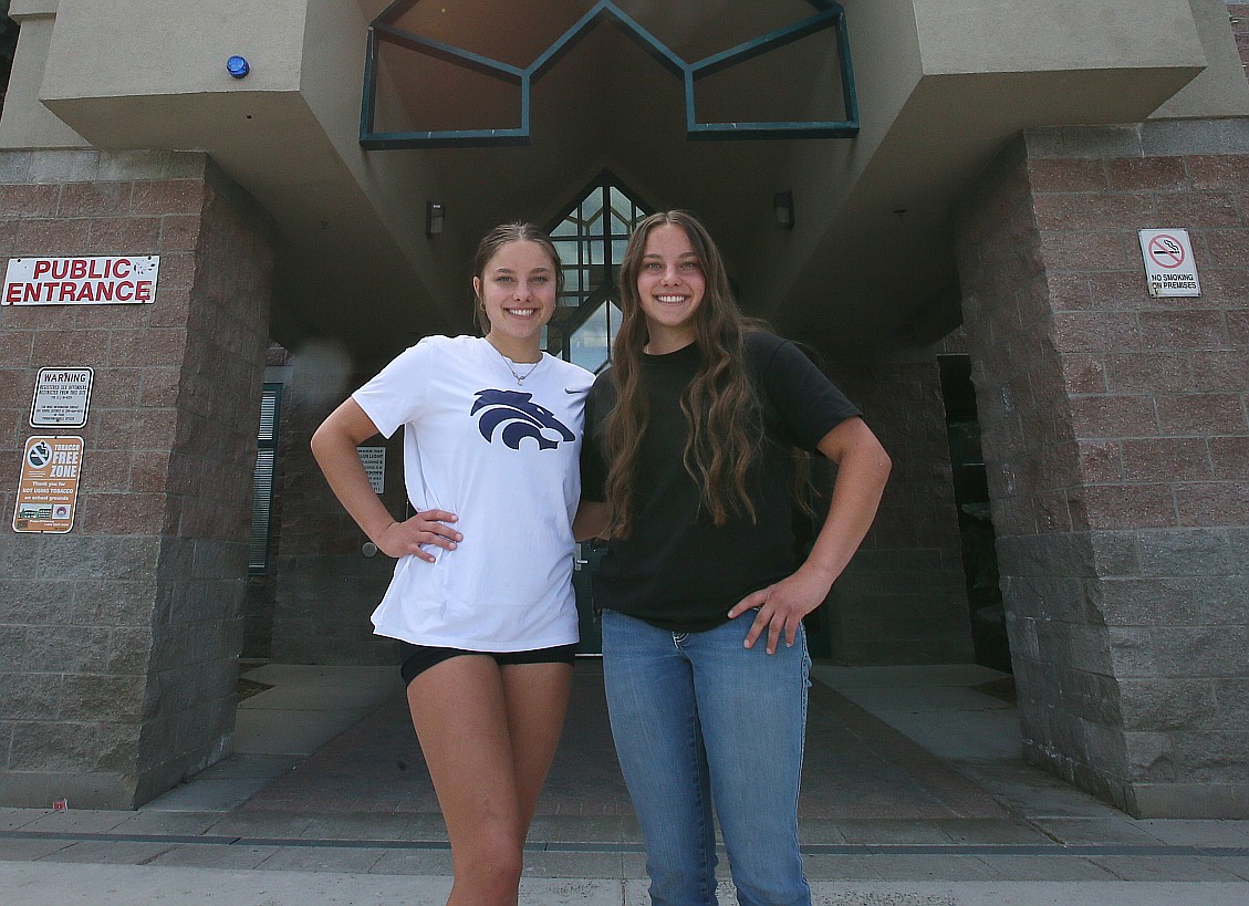 Jillian Scott, left, and identical twin sister Acaja Scott are graduating from Lake City High School in the Class of 2024 with accolades and bright futures ahead. Jillian is going to Boise State University after earning an associate degree through North Idaho College's dual-enrollment program and Acaja will attend Embry Riddle Aeronautical University and serve in the Marine Corps. The twins are seen Friday outside the school.