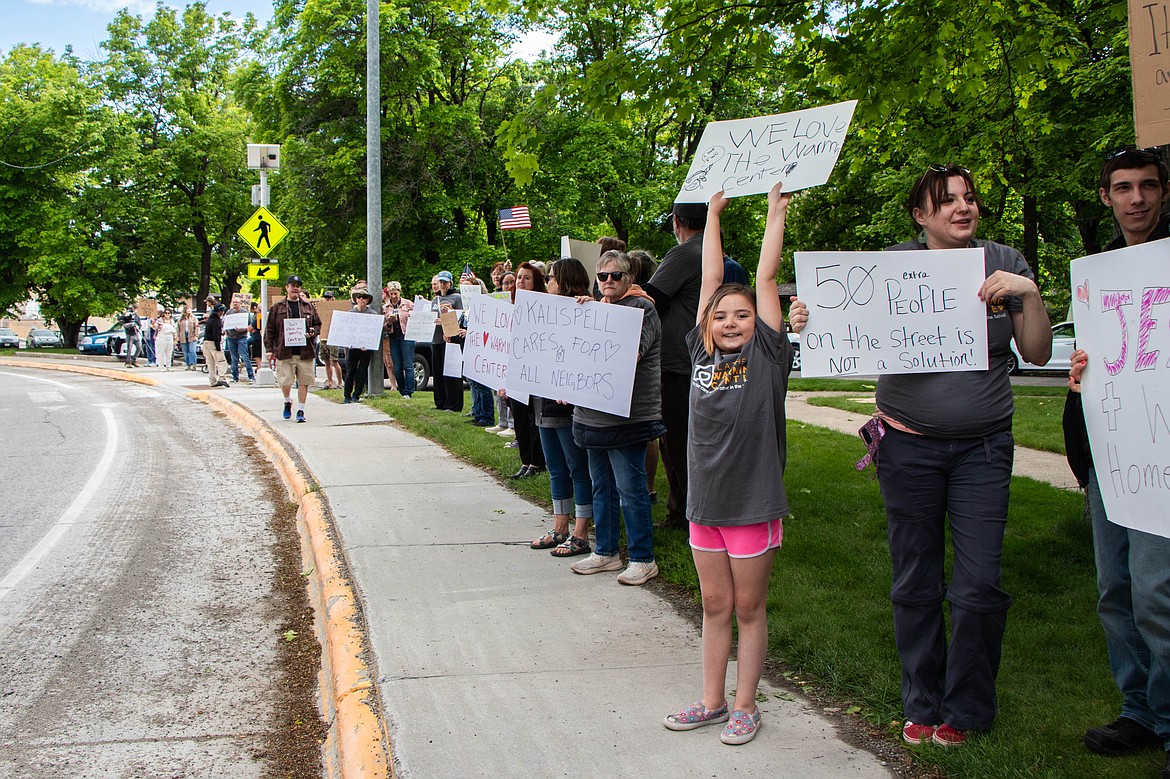 Lennon Seiter, 9 years old, holds a sign up at a rally in support of the Flathead Warming Center on May 30, 2024. Her other, Britta Sago, works at the Center. (Kate Heston/Daily Inter Lake)