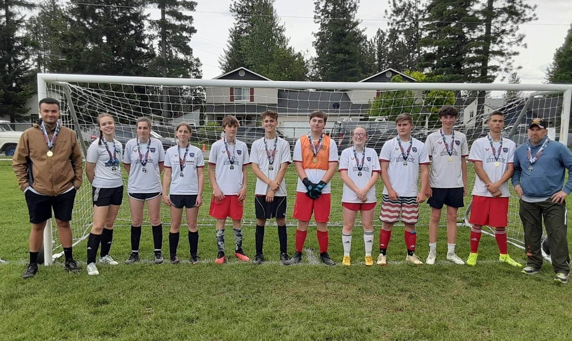 The Sandpoint Rec League 'Aftershocks' won the U14-U18 championship. From left to right are coach Max Dunton, Sarah Hazard, Shyra Bergey, Lydia Lowman, Oliver Siebunhr, Hunter Borges, Elliott Cunningham, Mallory Pierce, Drake Mulder, Hudson Asquith, Dustin Borges, and coach David Mulder. Not pictured are Bryce Campbell, Thomas Fisher, Aubrey McNaughton and David Mulder (son).