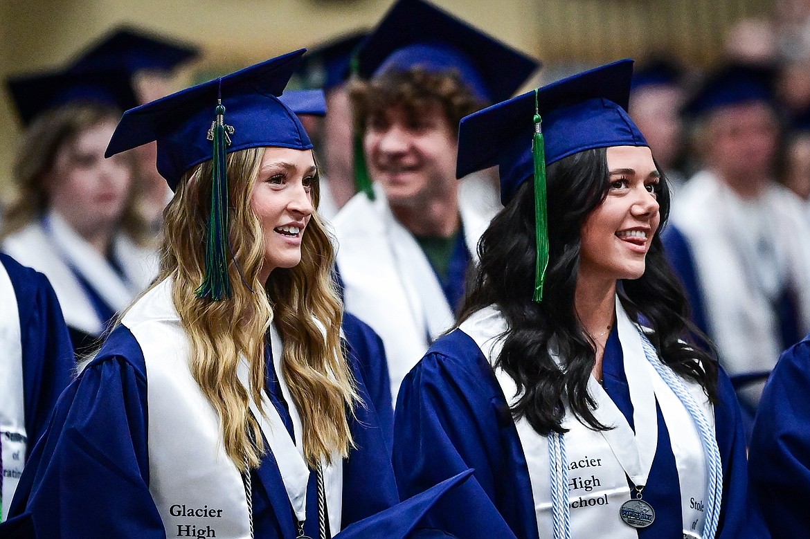 Graduates stand and smile as different academic and extracurricular accolades are announced at the Glacier High School class of 2024 graduation ceremony on Saturday, June 1. (Casey Kreider/Daily Inter Lake)