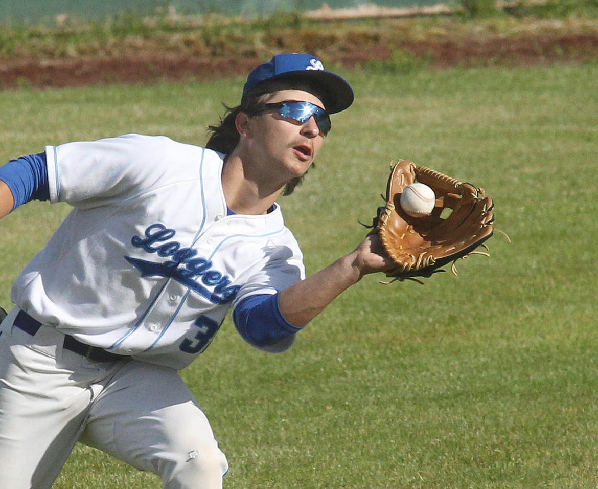 Libby Loggers left fielder Ian Thom catches the ball for the second out of the third inning off the bat of Kalispell's Brady Buckmaster Wednesday, May 29. (Paul Sievers/The Western News)