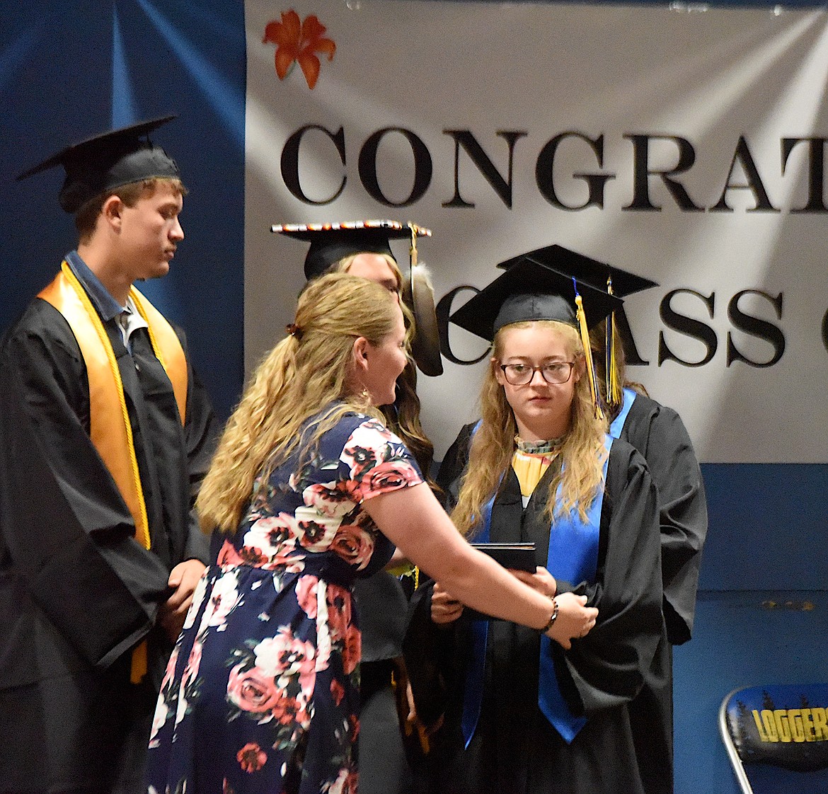 Libby High School Class of 2024 graduate Faith Erickson receives her diploma at graduation ceremonies Saturday, June 1, 2024. (Scott Shindledecker/The Western News)