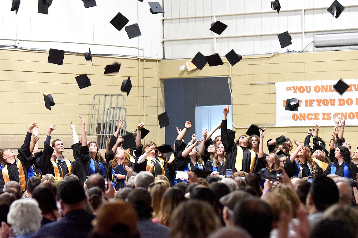 The Class of 2024 Libby High School graduates toss their caps at the end of graduation ceremonies Saturday, June 1, 2024. (Scott Shindledecker/The Western News)