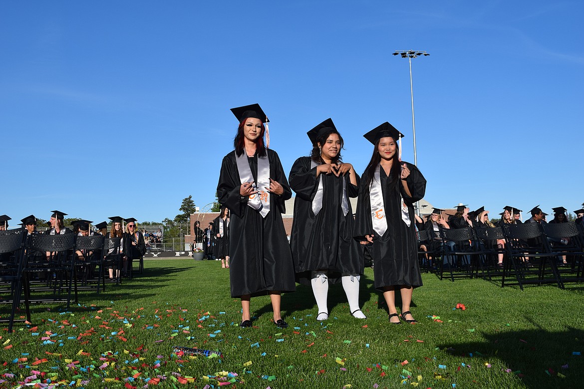 Whether it was devil horns, love or pinchin' pennies, these three Tigers grads were ready to collect their paper and move on to bright futures.