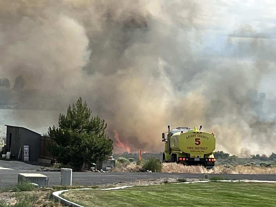 Area resident Micahel McPherson took this photo of a Grant County Fire District 5 vehicle on the scene of a fire at the north end of Moses Lake on Saturday. The fire started due to someone burning in windy conditions, authorities said.