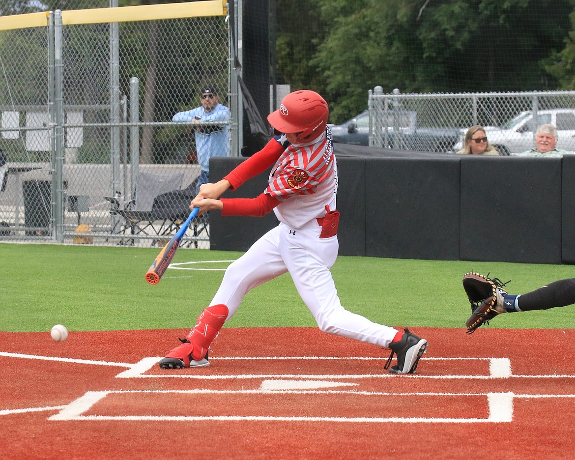 Jacob Alexander knocks a single to left field during the Lakers' second game against the Cubs on Saturday.
