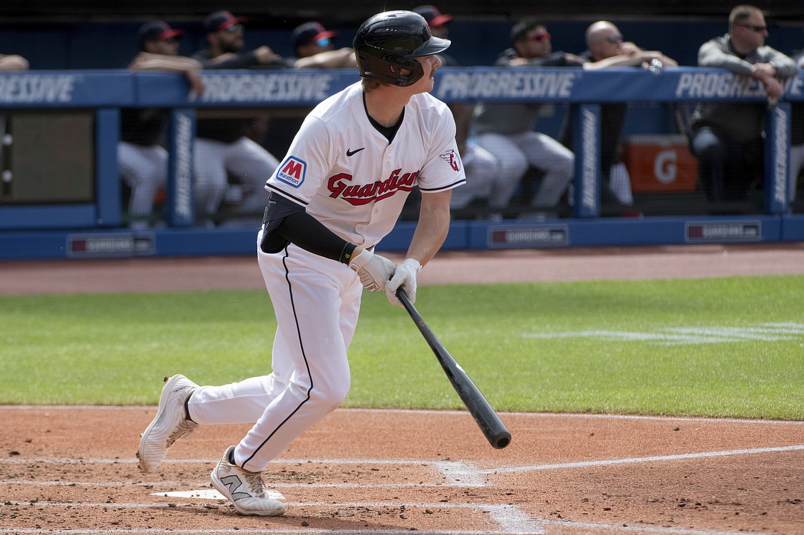 PHIL LONG/Associated Press
Kyle Manzardo of the Cleveland Guardians, the former Lake City High star, watches his RBI single off Washington Nationals starting pitcher Mitchell Parker during the first inning Saturday in Cleveland.