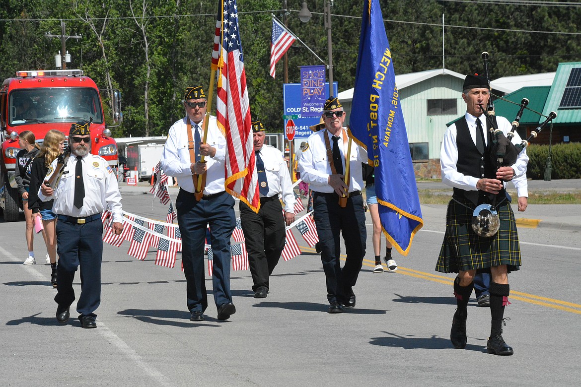 Members of the public were welcome to march down to the St. Regis river following behind the Legion members, once at the bridge they explained that the act of throwing a wreath into the waters below was to commemorate those who were killed in the line of duty, in the maritime branches of the military. (Mineral Independent/Amy Quinlivan)