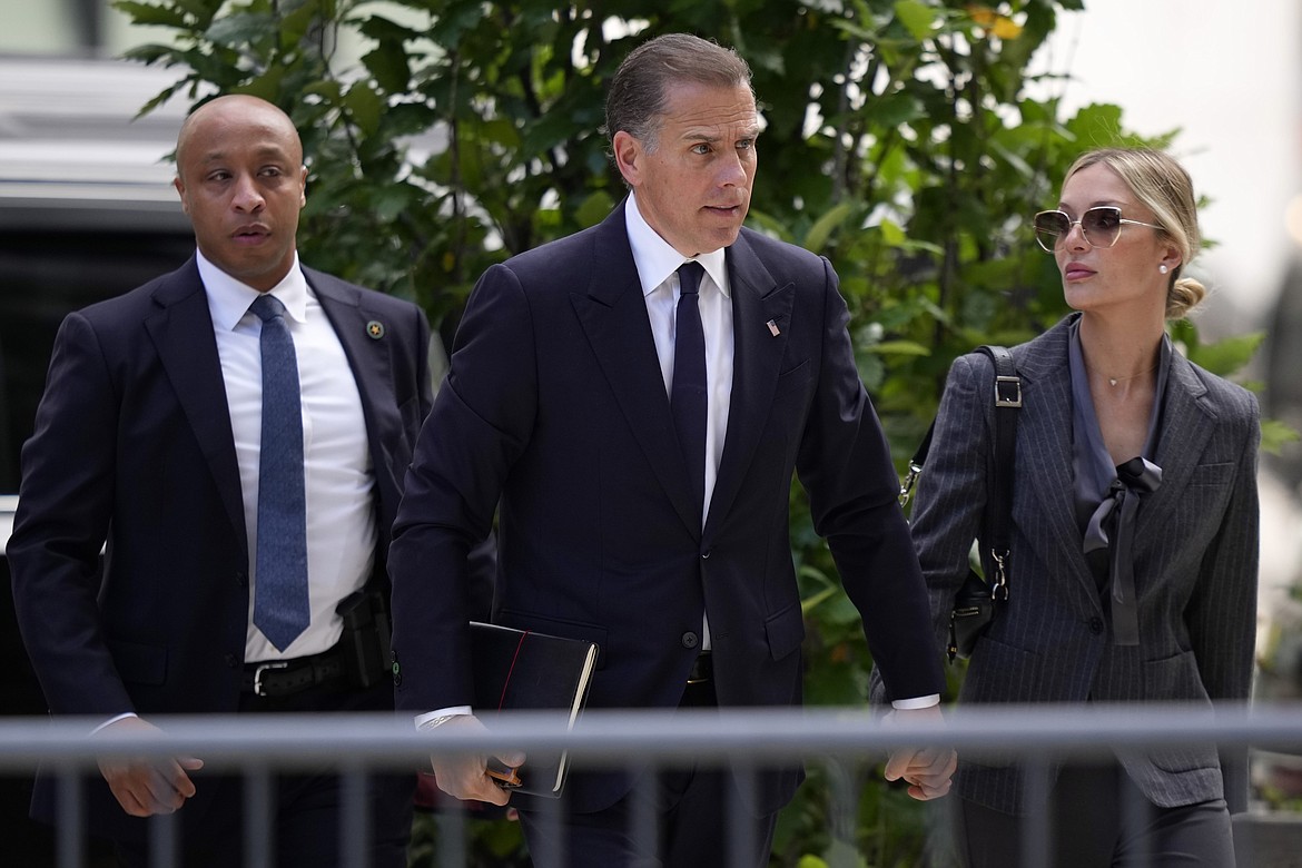 Hunter Biden, center, and his wife, Melissa Cohen Biden, right, arrive at federal court, Monday, June 3, 2024, in Wilmington, Del. (AP Photo/Matt Slocum)