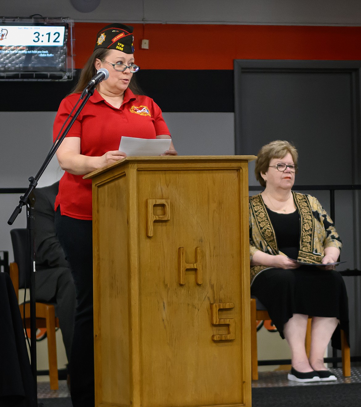 Heather Allen, Montana VFW state junior vice commander, speaks about Memorial Day during the Plains High School graduation ceremony. (Tracy Scott/Valley Press)