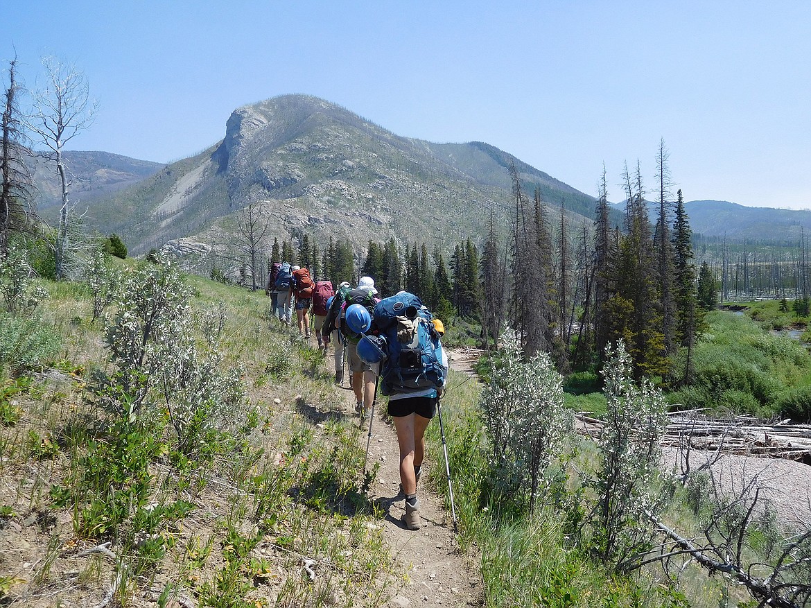 Volunteers head into the Bob Marshall Wilderness Foundation to work on trails. (Photo by BMWF)