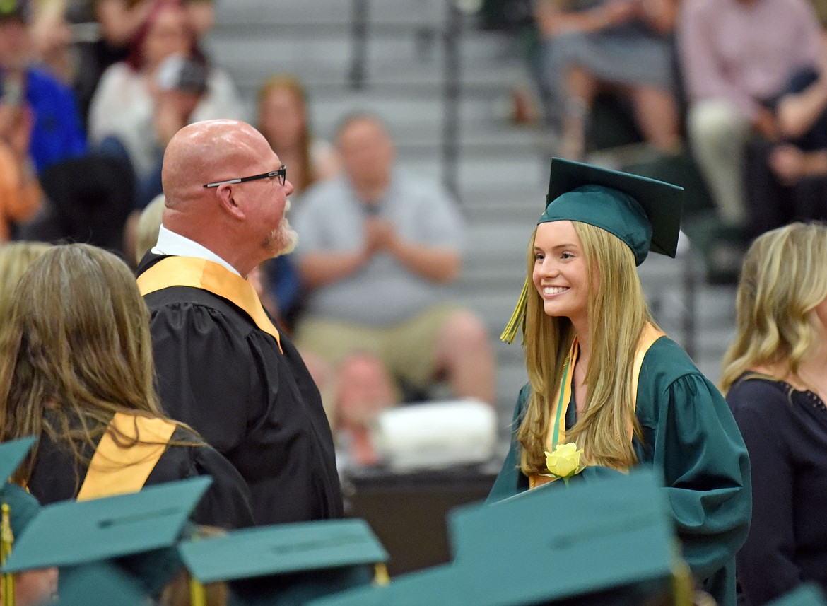 A 2024 graduate smiles with Principal Kerry Drowns. (Kelsey Evans/Whitefish Pilot)