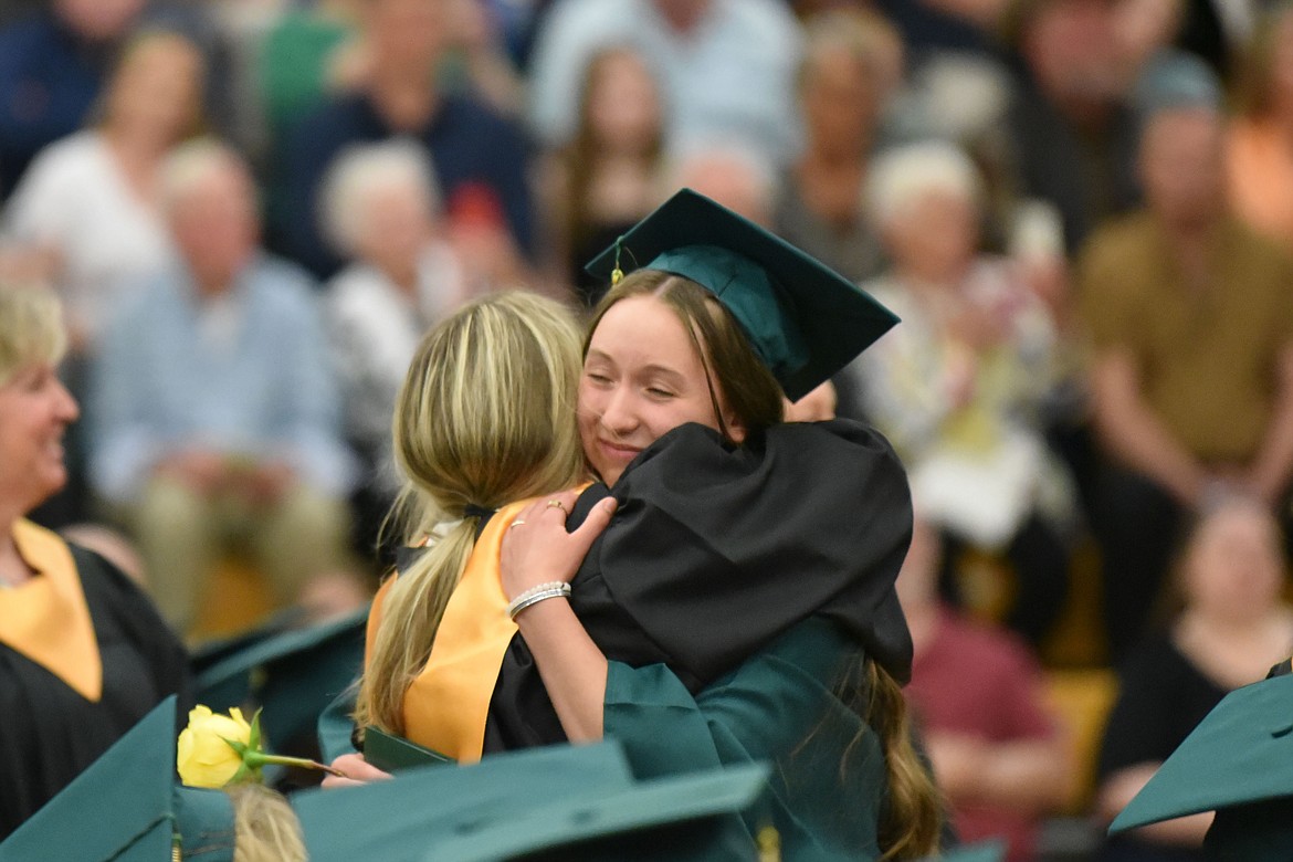 Graduate Zena Bonds hugs Health Instructor Kim Schneider. (Kelsey Evans/Whitefish Pilot)