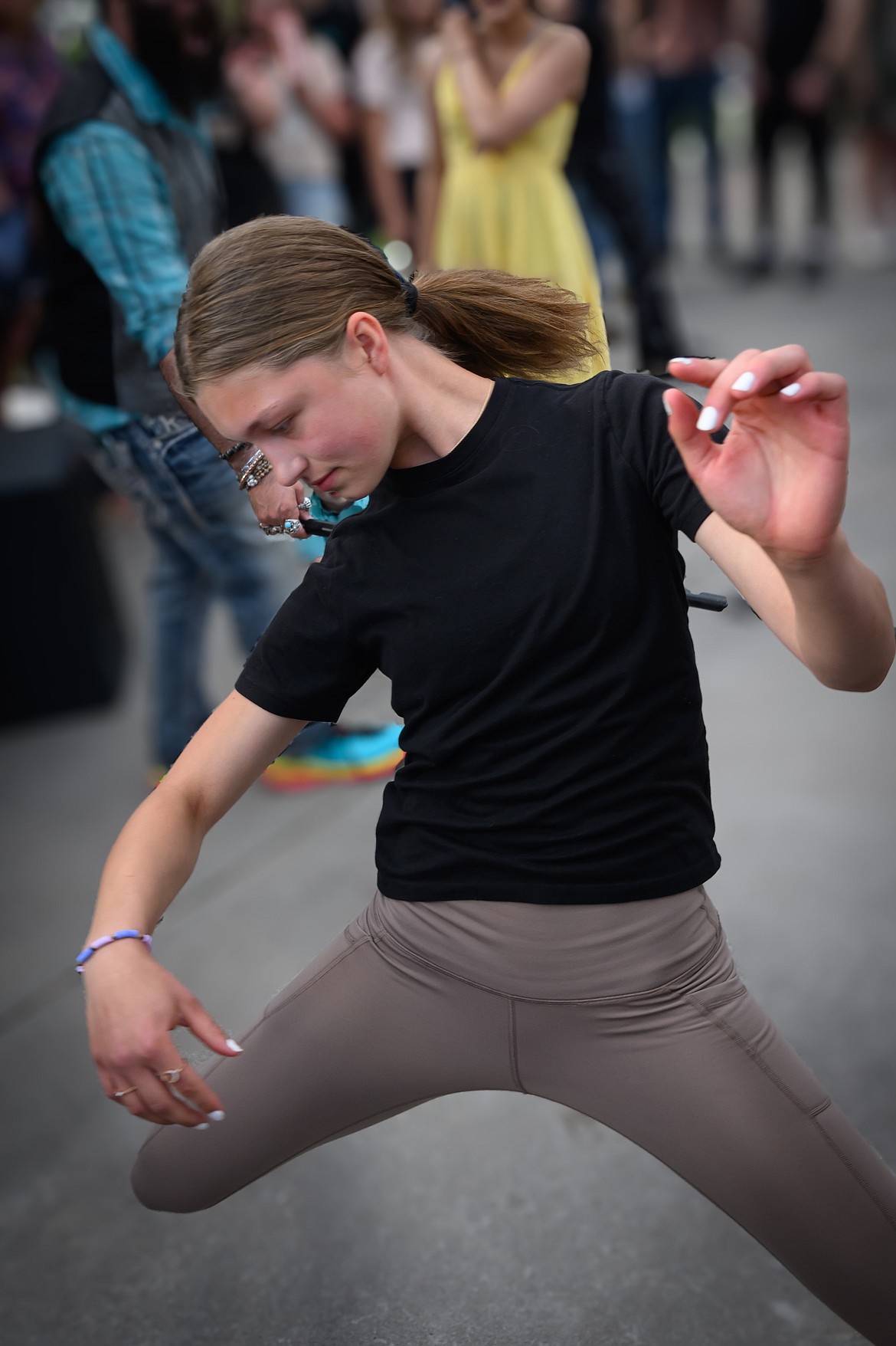 14-year-old Kora Hensrude wins the "tall" category in the limbo contest. (Tracy Scott/Valley Press)