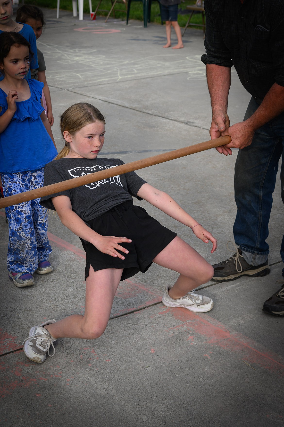 Madison Sturdivant, 10, takes first place in the "short people" limbo contest. (Tracy Scott/Valley Press)