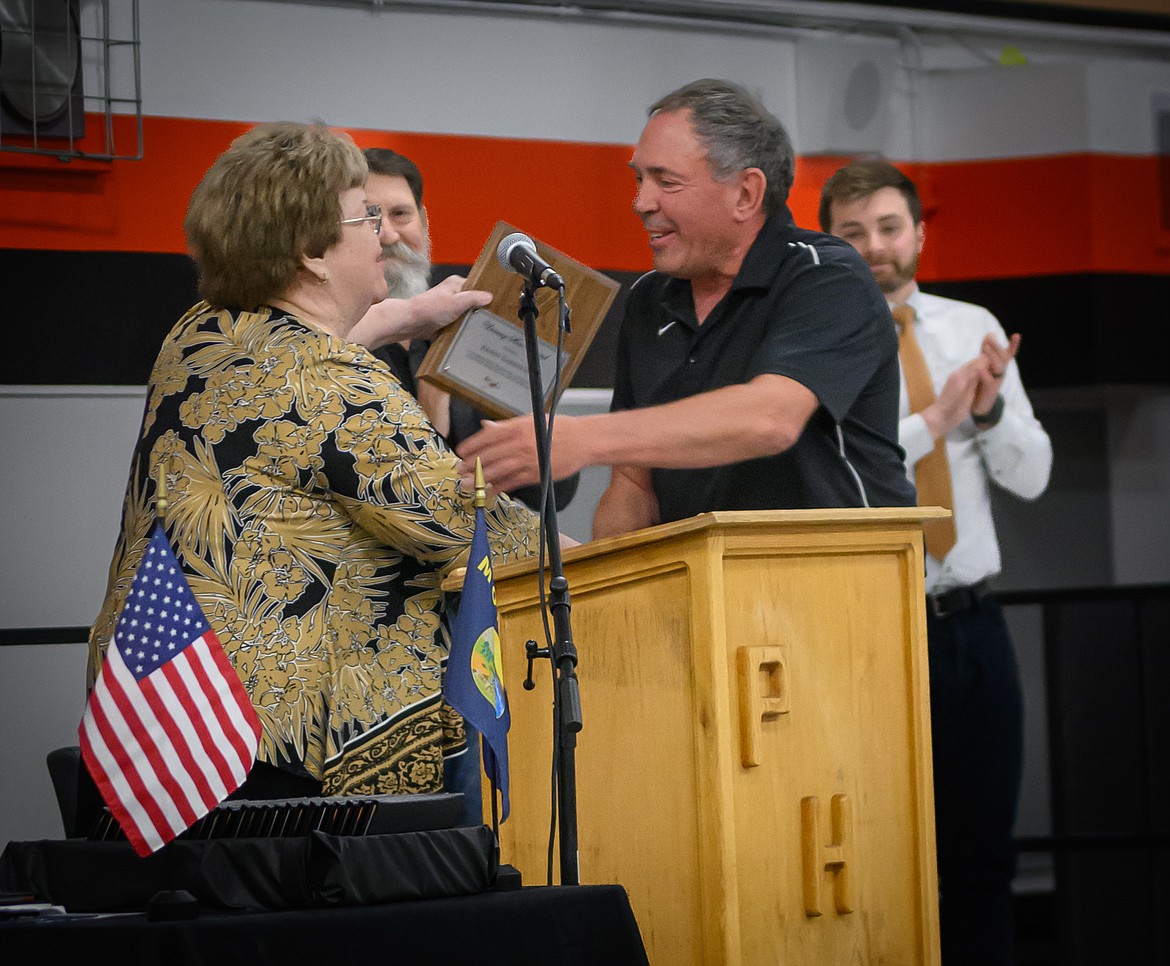 Randy Garrison receives the Unsung Hero Award from Plains Superintendent Dr. Walsh. (Tracy Scott/Valley Press)