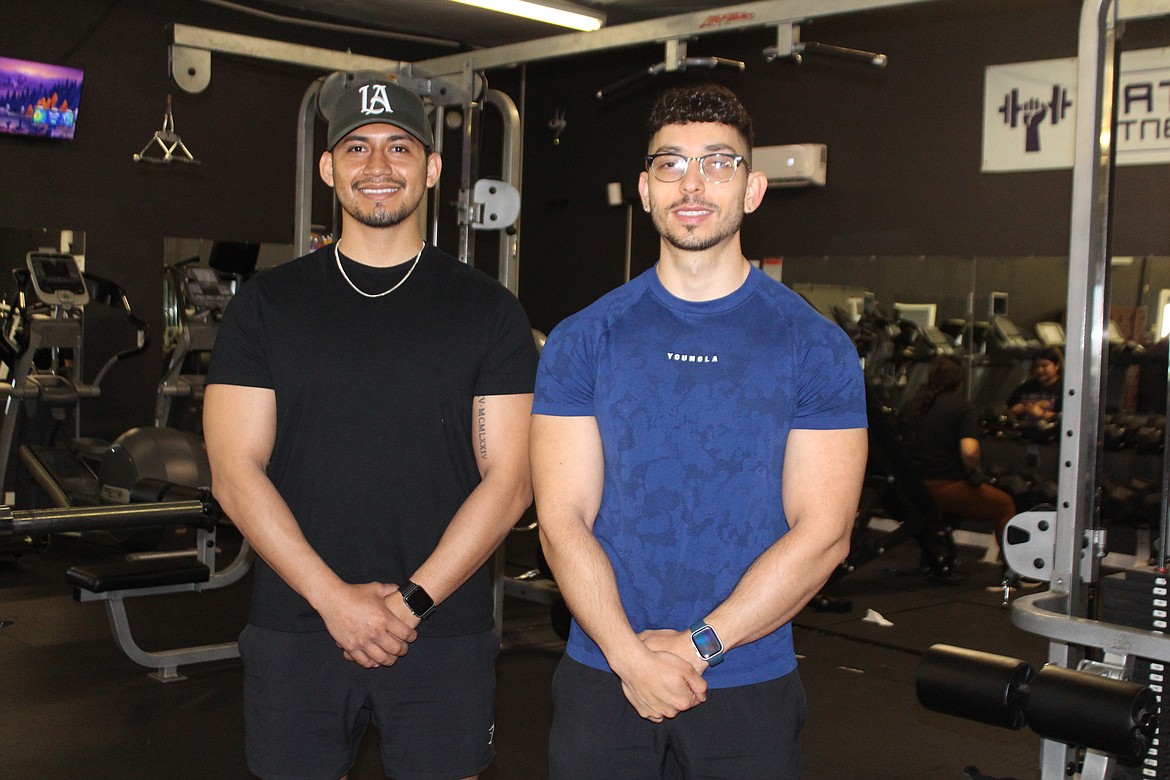 Mattawa Fitness Club owners Hector Guzman, left, and Ulises Sanchez, right, work second jobs in addition to running their own business.