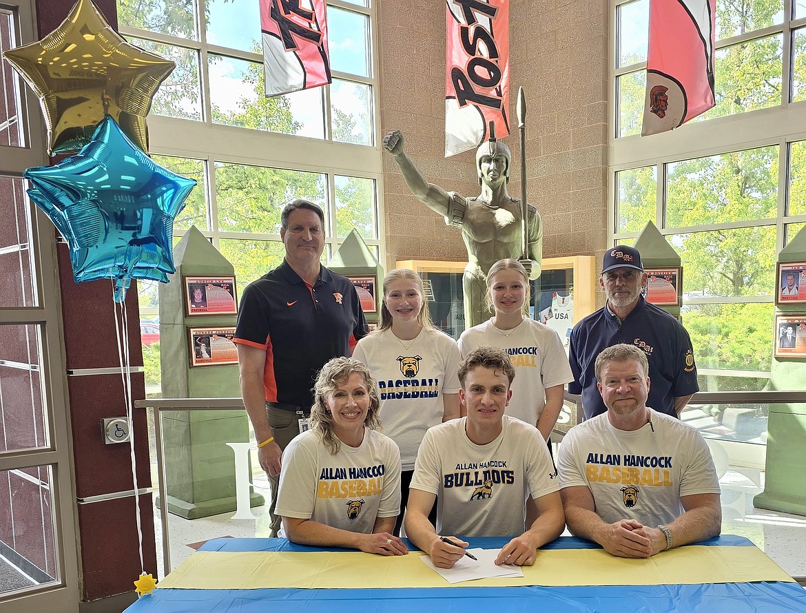 Courtesy photo
Post Falls High senior Isaac Ziegler recently signed a letter of intent to play baseball at Allan Hancock (community) College in Santa Maria, Calif., Seated from left are Dana Ziegler, Isaac Ziegler and Nathan Ziegler; and standing from left, Craig Christensen, Post Falls High athletic director; Samantha Ziegler, Claire Ziegler and Darren Taylor, Coeur d'Alene Lumbermen "AA" American Legion baseball head coach.