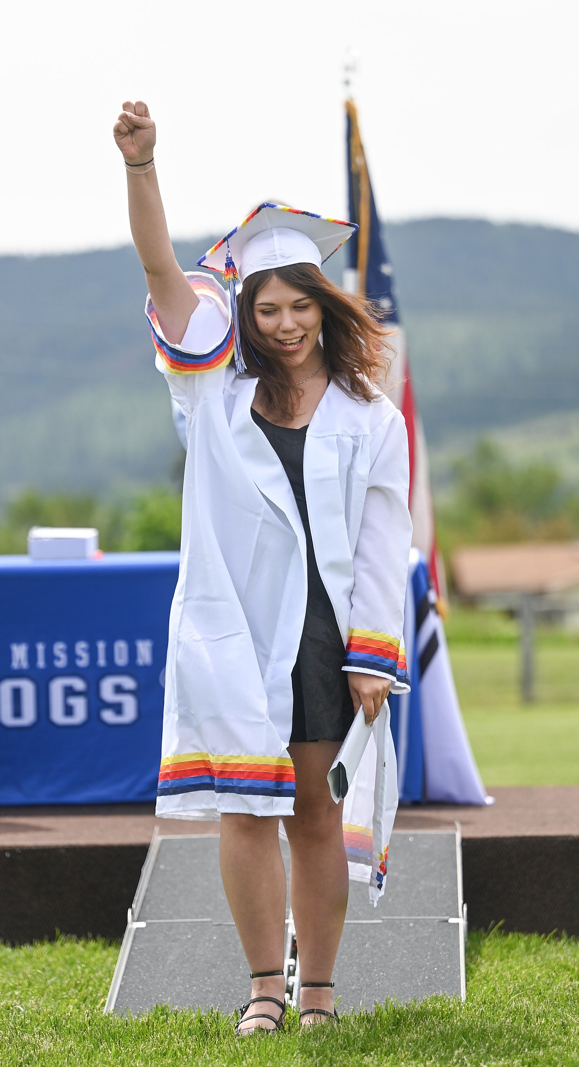 Klo'E Kipp gives a celebratory fist pump after receiving her diploma Saturday in St. Ignatius. (Christa Umphrey photo)