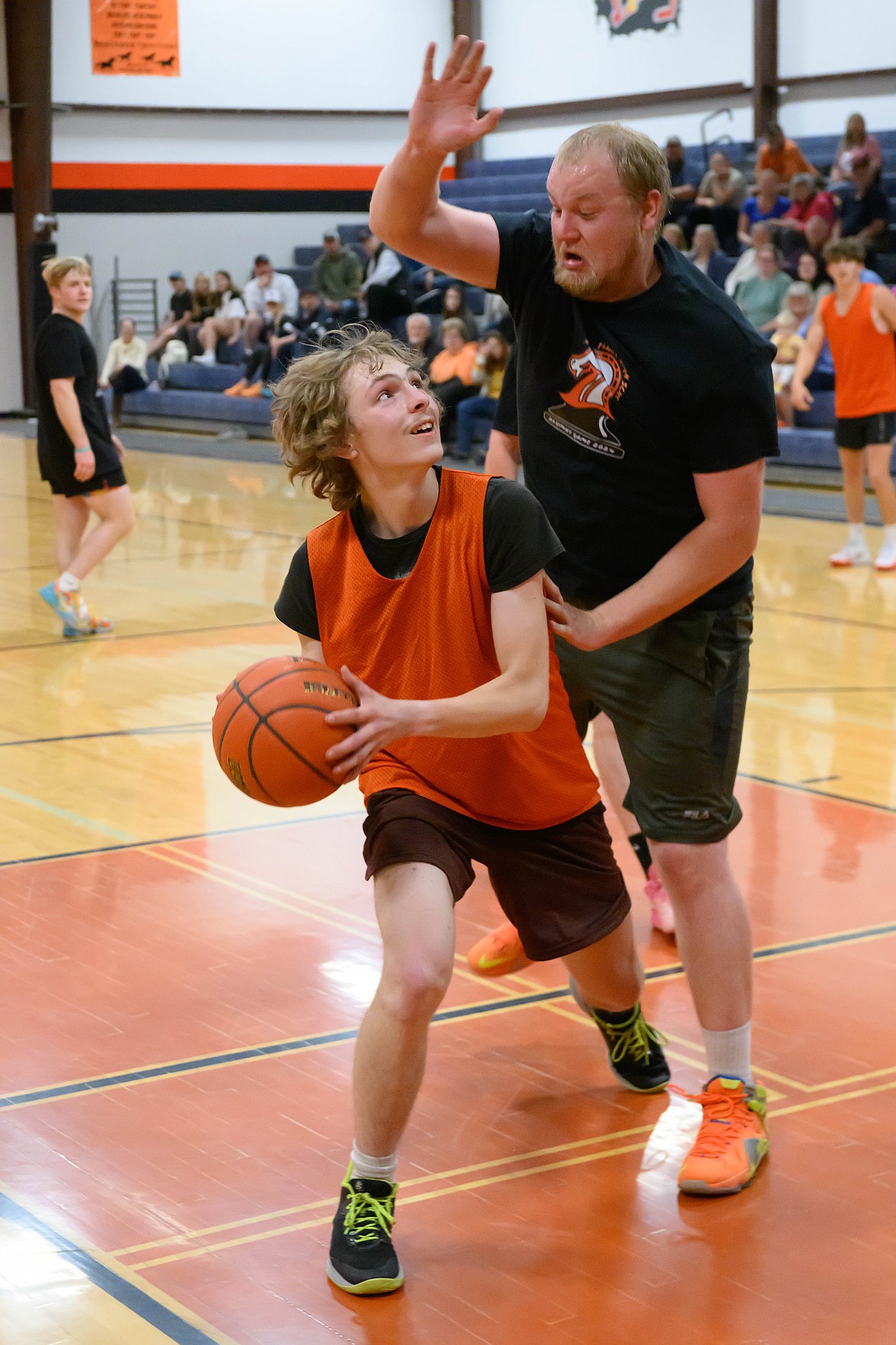 Old team member Parker Flock attempts to block Young team member Coby Anderson. (Tracy Scott/Valley Press)