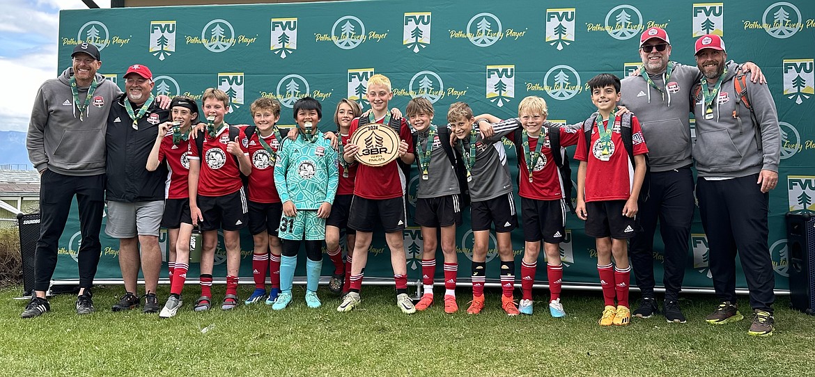 Courtesy photo
The 2012 Timbers North FC Academy black soccer team was runner-up at the 3 Blind Refs Tournament in Kalispell, Mont. From left are coach Scott McNiel, coach Ian McKenna, Alister Campbell, Colin Hutchins, Connor McKenna, Mateo Ethan Mariano, Camden Nelson, Mason Melison, James Greene, Mason Fantozzi, Micah Brumbach, Henry Bowlby, coach Robin Bundy and coach Nick Funkhouser.