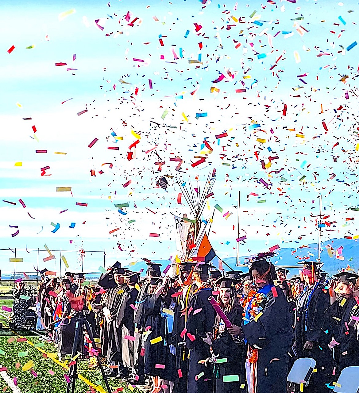 Ronan High School's Class of 2024 launched confetti after they received their diplomas as high school graduates. (Berl Tiskus/Leader)