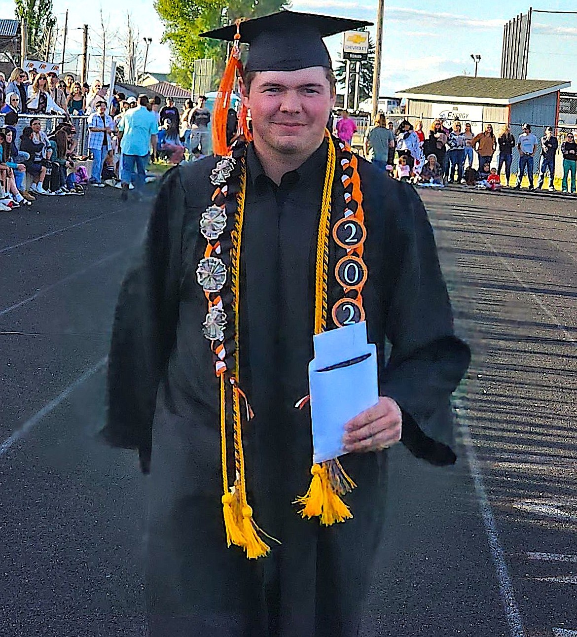 Ronan graduate Coleton Sherman has a big grin on his face as he heads to greet the Ronan High School teachers. (Berl Tiskus/Leader)