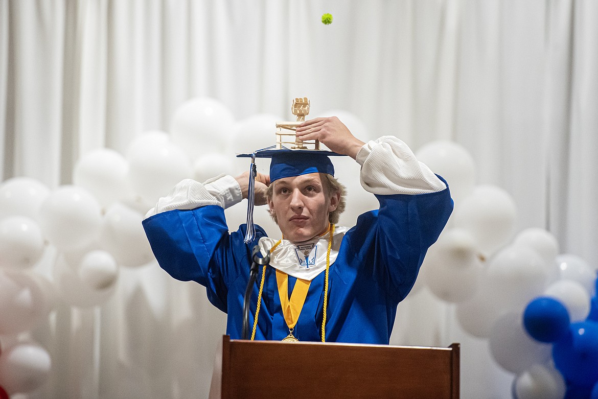 Class president Wyatt Johnson demonstrates his grad cap catapult during the graduation ceremony Saturday, June 1. (Avery Howe/Bigfork Eagle)