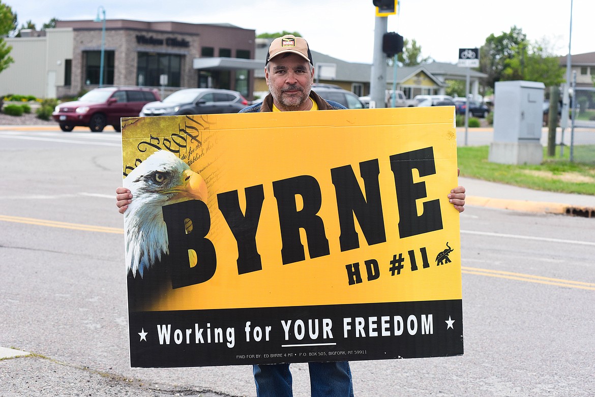 Congressional hopeful Ed Byrne, a Republican running in House District 11, campaigns at the entrance to the Flathead County Fairgrounds on June 4, 2024. (Kate Heston/Daily Inter Lake)