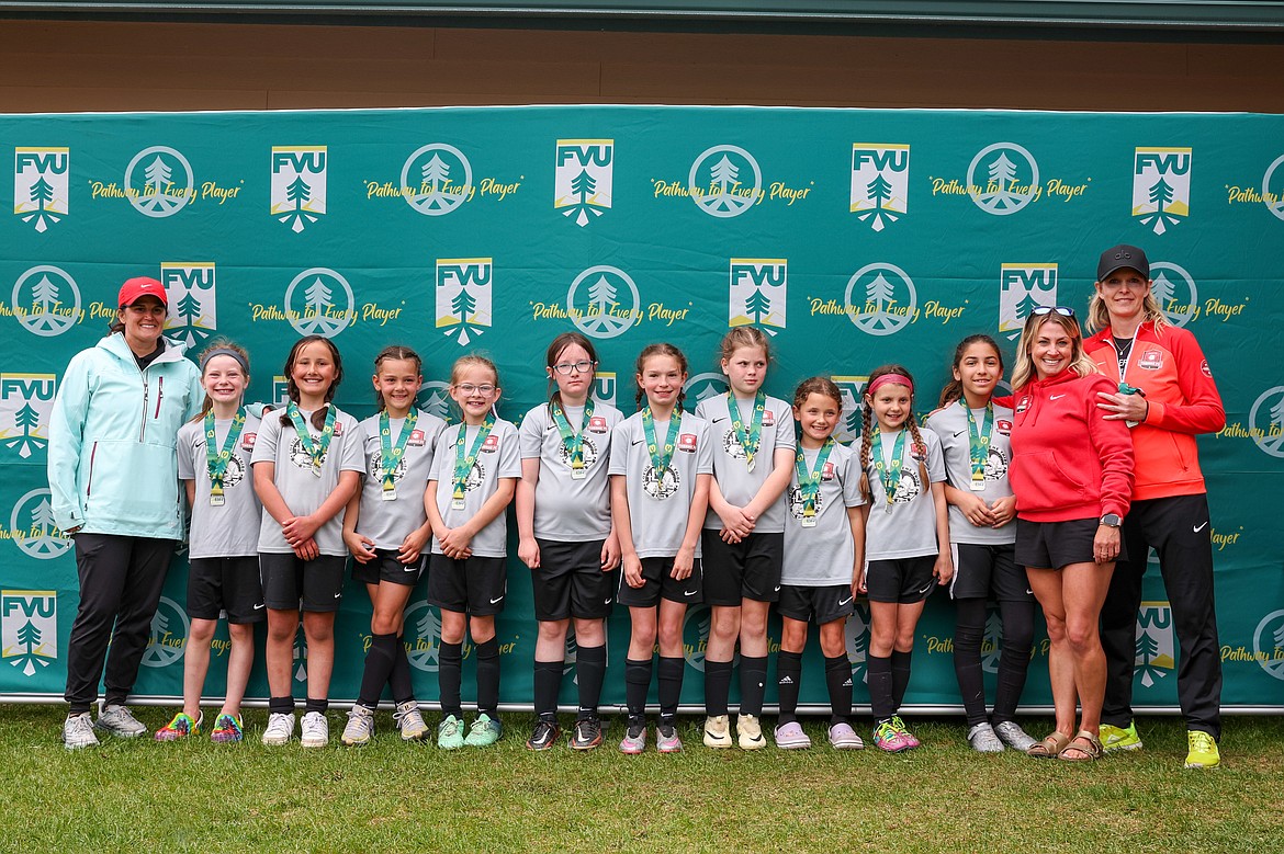 Photo by BUSCEMA PHOTOGRAPHY
The Thorns North FC 14 Girls Black soccer team took second place in the Silver bracket at the 3 Blind Refs tournament in Kalispell, Mont., last weekend. The first game was a tie with Montana Rush Blue 3-3, with goals scored by Finley Martin and 2 goals by Poppy Moreau. The second game was a 5-1 win against Polson FC with scores by Poppy Moreau (2 goals), Finley Martin (2 goals) and Harper Andersen. The third game was a 3-2 loss against their own Thorns North FC 14 Girls Red team, with the two Black goals scored by Finley Martin. This brought them to the championship game, also against the Thorns North FC 14 Girls Red. The Thorns Black lost 4-2, with goals by Harper Andersen and Finley Martin. Pictured from left are coach Katie Martin, Harper Andersen, Poppy Moreau, Finley Martin, Rylan Parks, Lyla Maestas, Lydia Frank, Elsie Hewitt-Nord, Brooklyn Simoni, Stella Hartzell, Sophia Moreno, coach Jean Carper and coach Kara Lemmon.