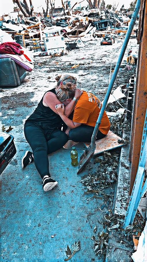 Haley Williams is comforted by her mom, LeAnn McVay, at her home in Greenfield, Iowa that was destroyed by a tornado on May 21.