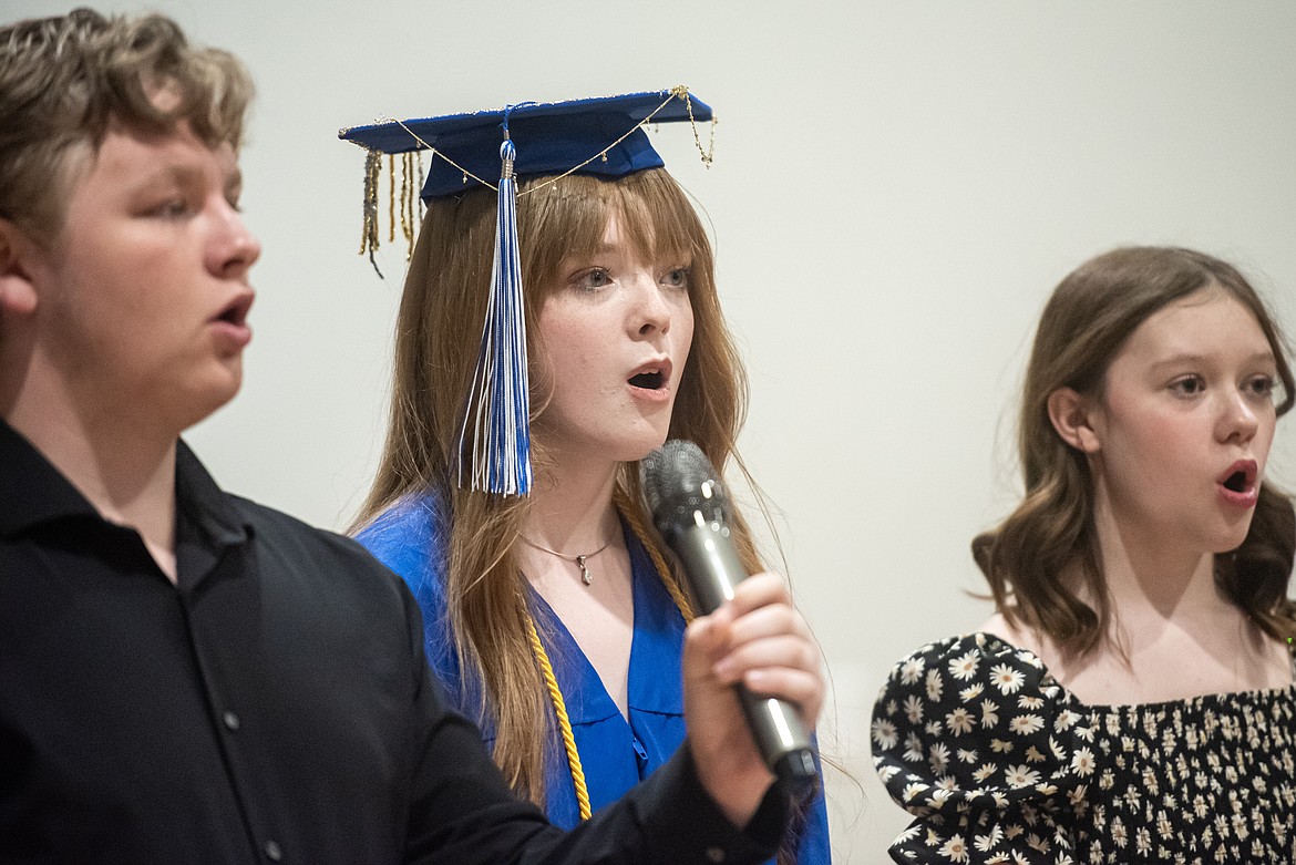 Hailee Elwell sings the national anthem at graduation. (Avery Howe/Bigfork Eagle)