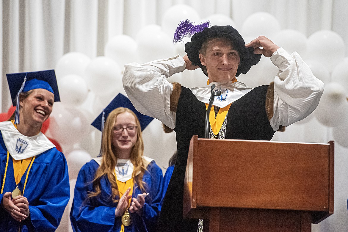 Wyatt Johnson swaps his cap for a feathered hat to perform Shakespeare as a last-minute assignment during his valedictorian speech at graduation Saturday, June 1. (Avery Howe/Bigfork Eagle photos)