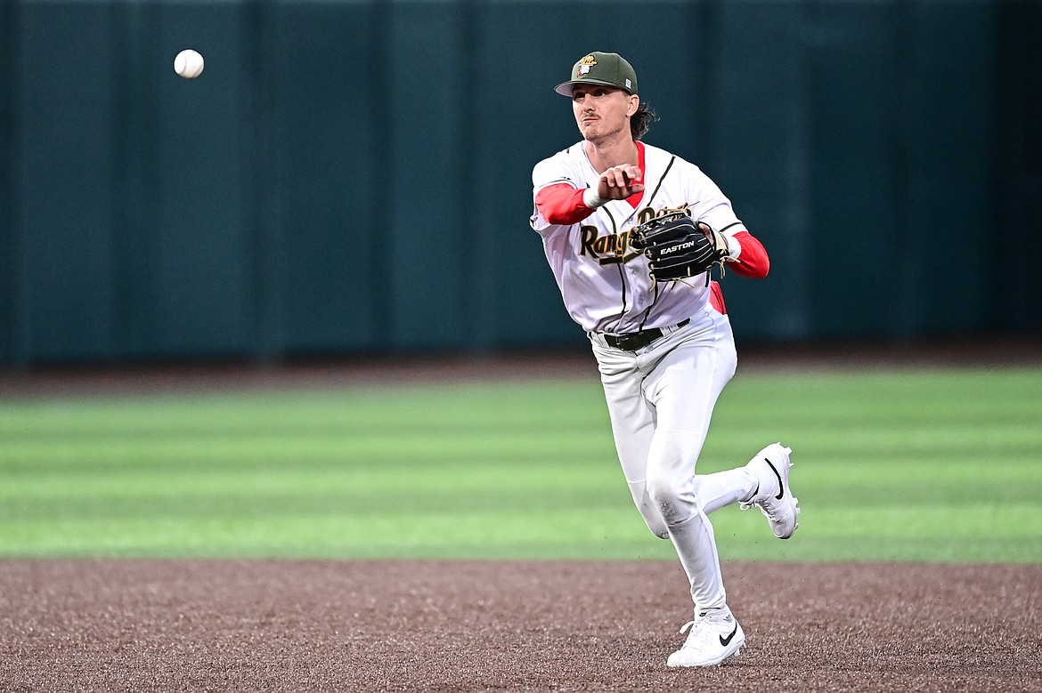 RANGE RIDERS shortstop Mason Dinesen (23) throws to first for an out against the Oakland Ballers at Glacier Bank Park on Tuesday, May 21. (Casey Kreider/Daily Inter Lake)