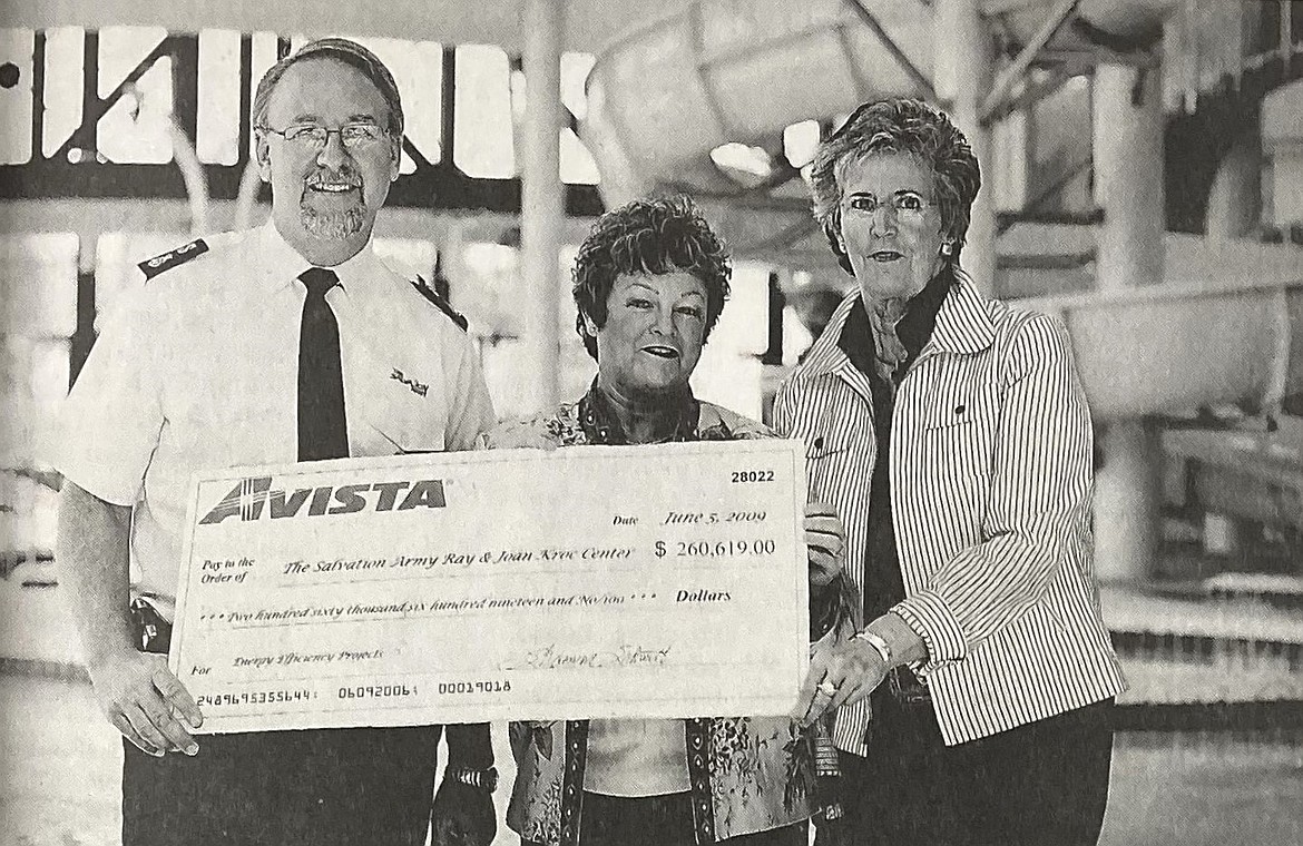 Sharman Schmitt of Avista presented a check for $260,611 to John Chamness of the Kroc Center and Sandi Bloem, chairman of the Kroc advisory board. The money was awarded for energy-saving features in the new building.