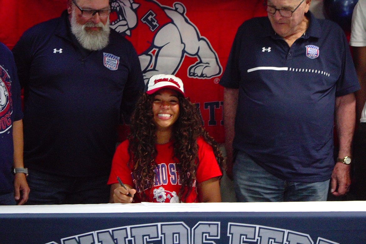 Asha Abubakari smiles after signing with FSU.